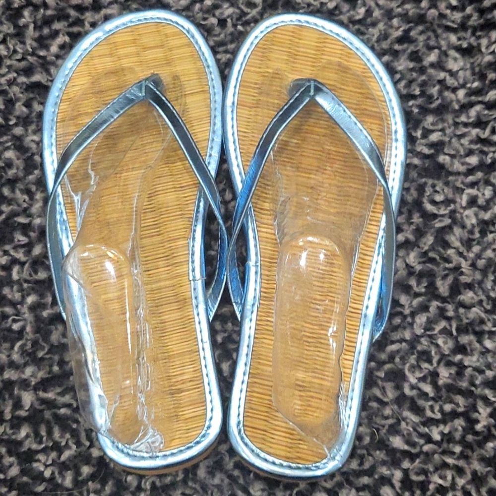 Brown and blue flip flops